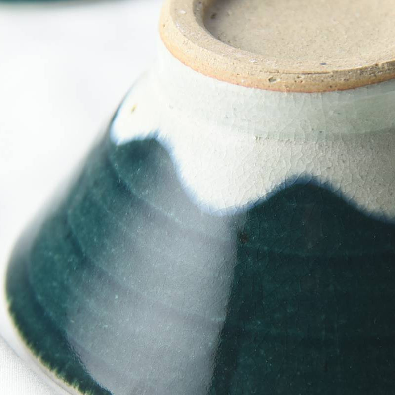 Close-up of a ceramic rice bowl with a gradient finish on a white background