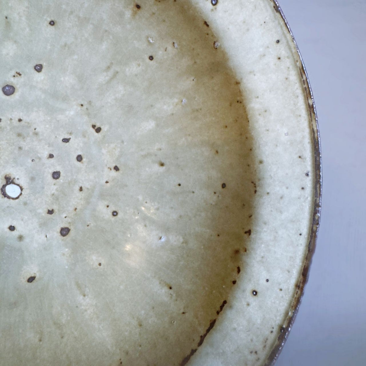 Close-up of the cream colour interior with scattered brown speckles from Senju Living