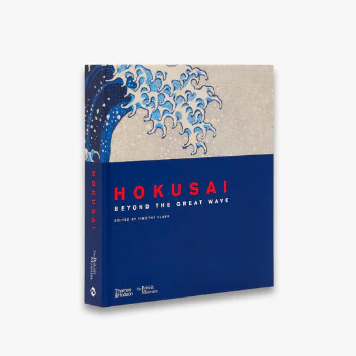 Book titled 'Hokusai: Beyond the Great Wave' with a wave design on the cover against a blue background.