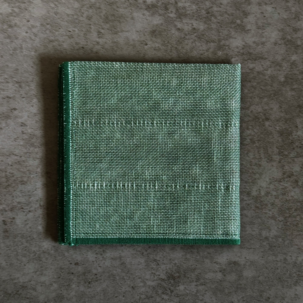 Green Japanese kitchen cloth on a grey background